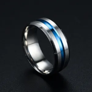 Close-up detail of silver titanium steel ring featuring a vibrant blue grooved center