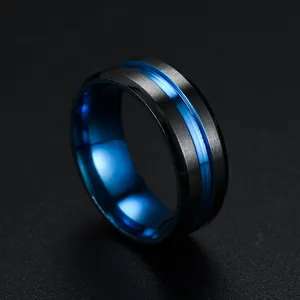 Macro view of men's titanium steel ring featuring black matte finish and electric blue groove