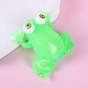 Close-up detail of the green translucent TPR squeeze frog toy with big bulging eyes