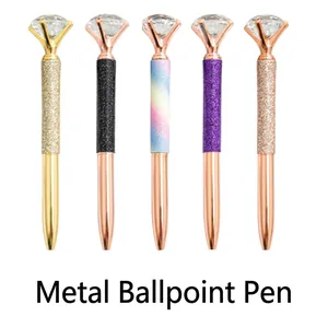 Set of five elegant multi-color metal ballpoint pens with large diamond crystal toppers.
