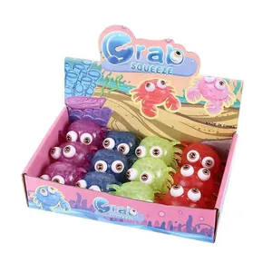 Colorful TPR squeeze crab toys with big eyes in a display box for stress relief
