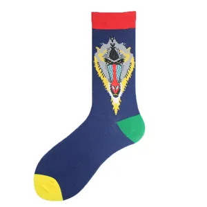Close-up of navy blue crew sock featuring a colorful baboon face design with color blocking