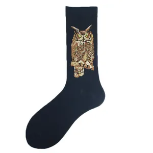 Detailed view of navy blue crew socks featuring a realistic owl pattern embroidery