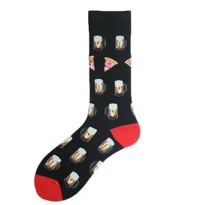 Close-up detail view of fun mid-tube socks with beer and pizza pattern on black