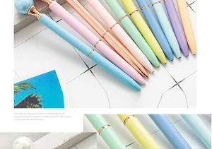 Detailed macro view of colorful pearl metal ballpoint pens in elegant macaron shades