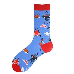 Detailed close-up of blue mid-calf socks featuring vibrant BBQ and grill patterns
