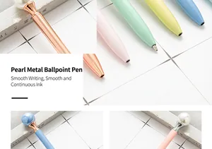 Detailed close-up of pearl-topped metal ballpoint pens in various pastel candy colors