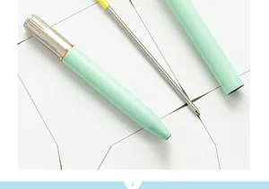 Detailed view of mint green metal ballpoint pen showing its premium metal refill design