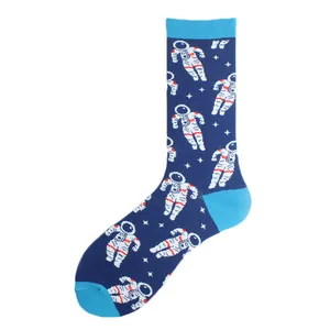 Detailed view of dark blue crew socks featuring a white astronaut and star pattern
