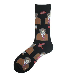 Close-up of black mid-calf socks featuring a repeating orangutan in suit pattern