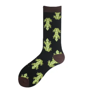 Detailed view of black crew socks with repeated green frog pattern and brown accents