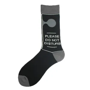 Close-up of black mid-tube sock with 'Please Do Not Disturb' text and grey accents