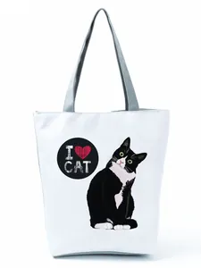 Close-up of white tote bag with cute tuxedo cat print and I Love Cat text design
