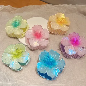 Set of 6 gradient plumeria hair claws with pearlescent finish for stylish hairstyling