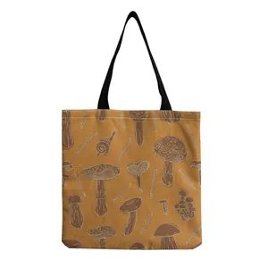 Detail of the vintage mushroom pattern print on a mustard yellow canvas tote bag