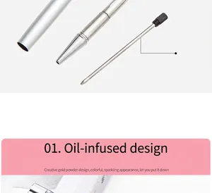 Detailed view of the original refill and oil-filled metal pen barrel with gold powder.