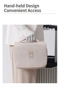 Portable beige waterproof toiletry bag with sturdy handle shown in travel scenario