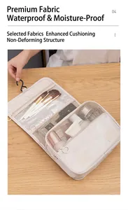 Detail showing internal compartments and hook of the beige waterproof toiletry bag
