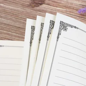 Vintage A5 notebook inner pages with elegant ornate borders and lined cream paper