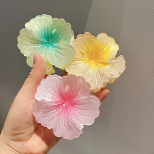 Three colorful gradient flower hair claw clips with Hibiscus design for stylish women