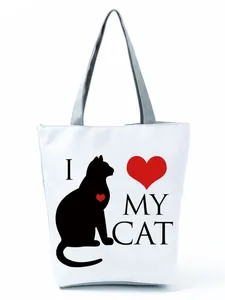 Detailed view of white tote bag featuring a black cat silhouette and I Love My Cat print