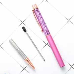 Pink glitter sand metal ballpoint pen with refill, creative hourglass design for girls.