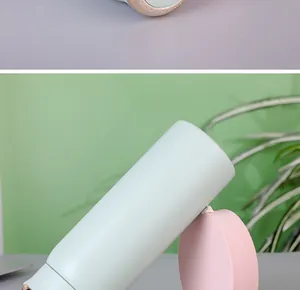 Macro view of a mint green 304 stainless steel vacuum insulated bottle with matte finish