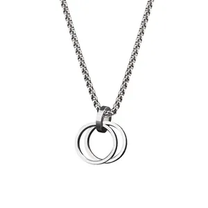 Close-up of minimalist interlocking double ring pendant on titanium steel chain