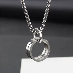 Detailed view of a minimalist titanium steel double ring pendant necklace for men and women