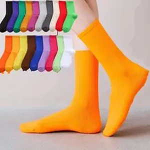 Vibrant orange cotton crew socks for skateboarding and street style sports fashion wear