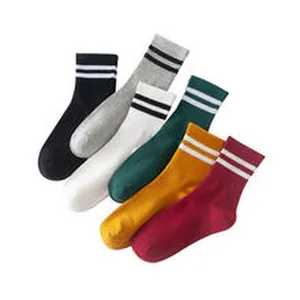 Detailed close-up of colorful striped mid-calf cotton socks available in five classic colors.