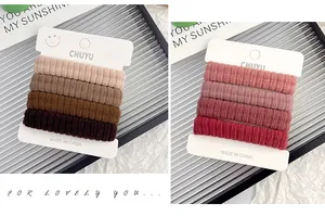 Close-up of seamless caterpillar hair ties in earth and red tones