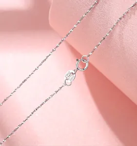 Macro view of sparkly S925 sterling silver necklace chain with Italy hallmark clasp