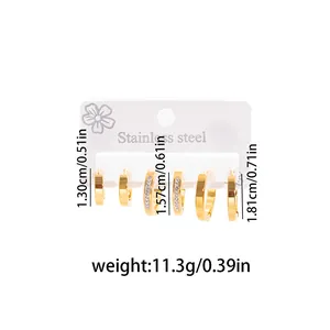 Close-up of three pairs of gold stainless steel hoop earrings with precise size markings