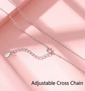 Macro view of a delicate S925 sterling silver cross chain with adjustable clasp