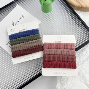 Pack of 8 high-elasticity seamless towel hair ties in various earthy and pink tones