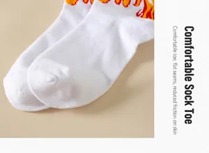 Close-up detail of the flat-seamed toe area on cotton socks with vibrant flame pattern.
