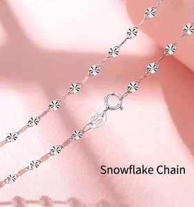 Detailed macro view of S925 sterling silver necklace featuring snowflake pattern links