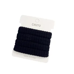 Set of 4 thickened black seamless high elasticity hair ties wrapped on a white display card