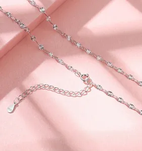 Detail view of S925 sterling silver snowflake chain with an adjustable spring clasp.