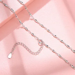 Detailed close-up view showing the S925 sterling silver melon seed chain links and clasp