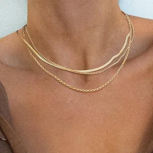 Layered gold necklace set with flat blade, curb, and rope chains for women stylish look