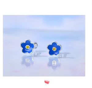 High-quality macro detail of s925 silver blue enamel flower screw-back stud earrings