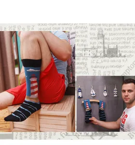 Detailed macro view of stylish men's mid-calf socks with a retro lighthouse pattern