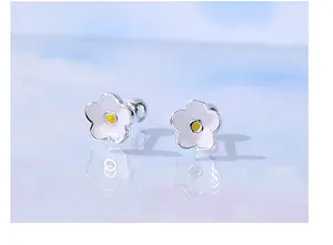 Close-up of s925 silver flower stud earrings with white petals and screw backs