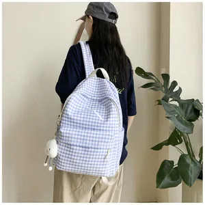 Light blue and white gingham schoolbag with delicate bow design and plush cloud charm