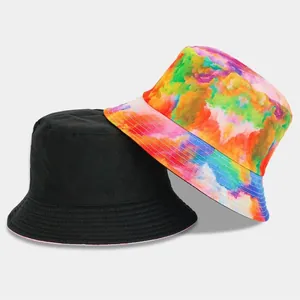 Trendy reversible tie-dye and solid black bucket hat for outdoor sun protection