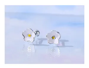 Detailed macro view of white enamel flower stud earrings with secure S925 silver screw back.