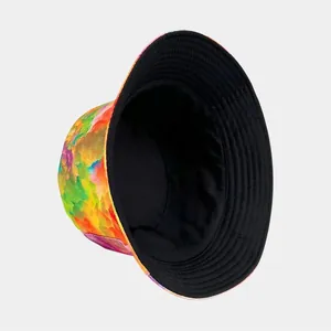 Reversible tie-dye bucket hat with colorful graffiti print for outdoor sun protection.