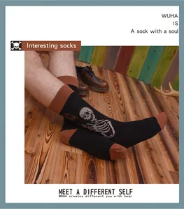 Close-up of men's retro mid-calf socks with skeleton pattern on vintage wooden floor